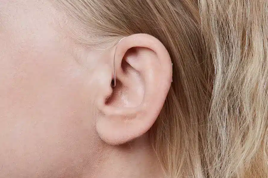 Oticon More miniRITE T C091SilverGrey Angle90 Close up In On Ear MS 6670 Woman 1200x800px Original file